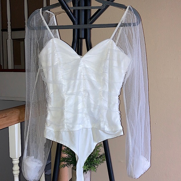 White bodysuit with dotted mesh sleeves. - Picture 2 of 5